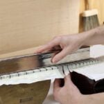 Should You Level Frets Straight, or With Relief?